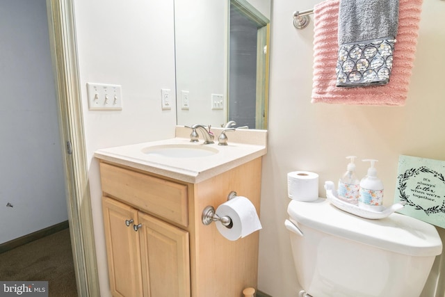 bathroom with toilet and vanity