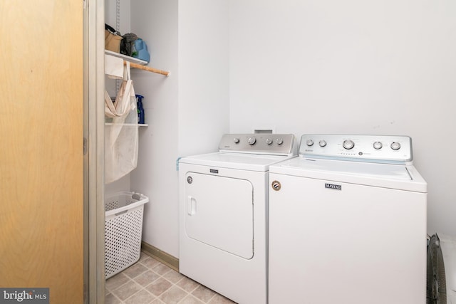 washroom with separate washer and dryer