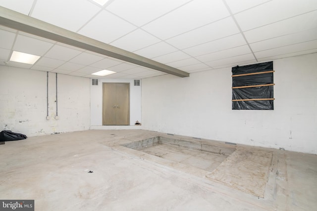 basement featuring a drop ceiling