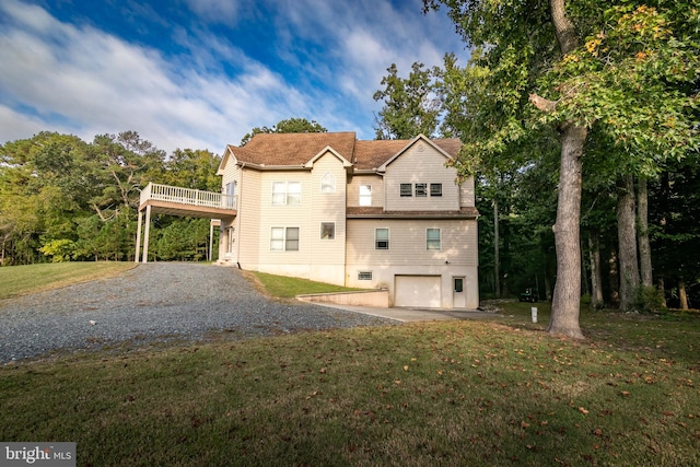 view of front facade with a front yard and a garage