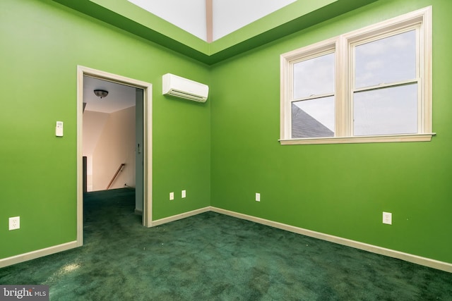 carpeted spare room with a wall unit AC