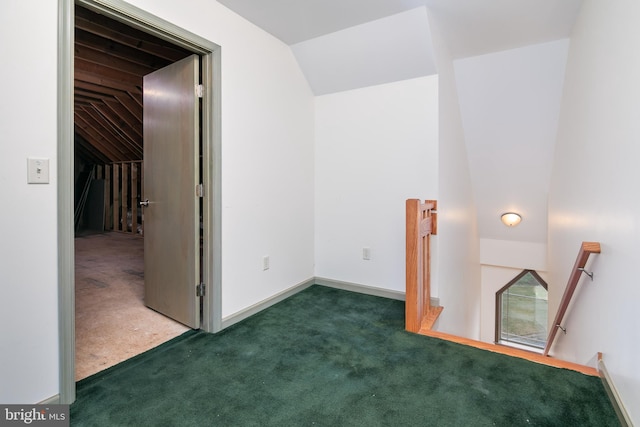 bonus room featuring dark carpet and lofted ceiling