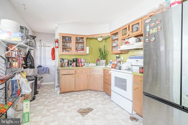 kitchen with custom exhaust hood, stainless steel refrigerator, and white electric range