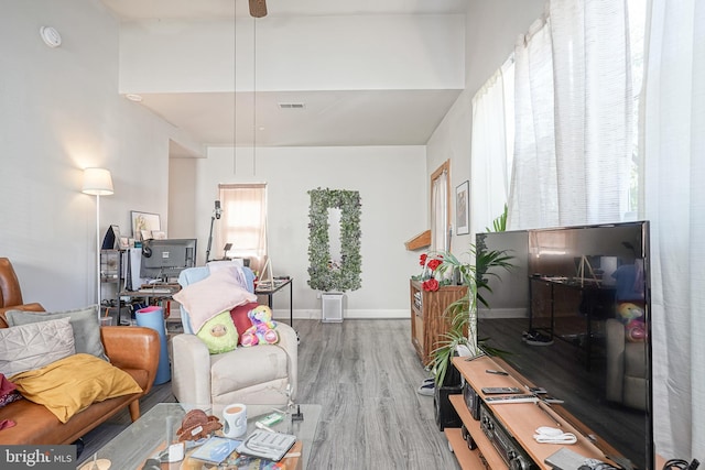 living room with wood finished floors and visible vents