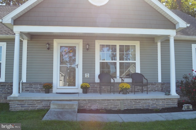 doorway to property featuring covered porch