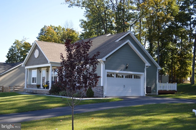 view of front of house featuring a front yard and a garage