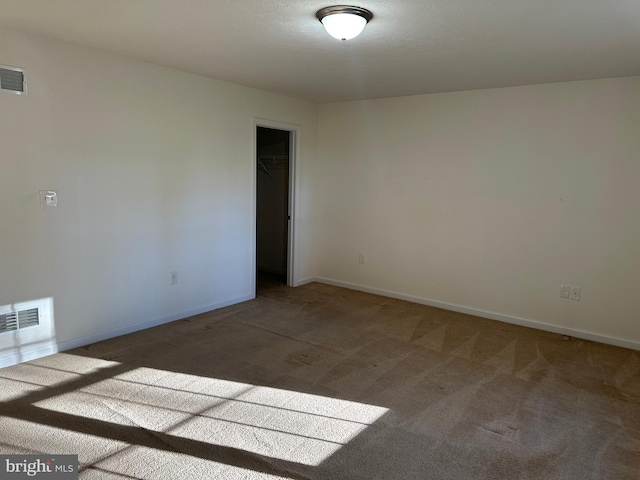 spare room featuring carpet floors