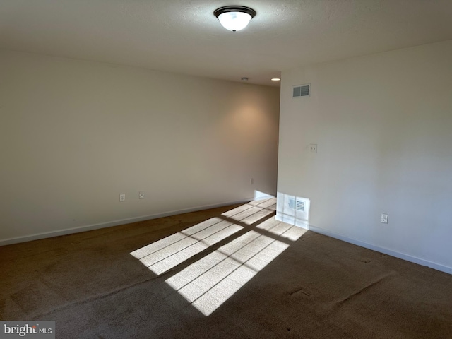 unfurnished room with light carpet