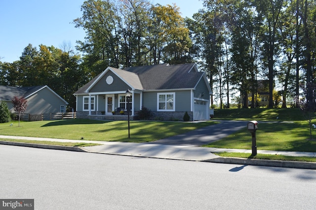 view of front of property with a front lawn and a garage