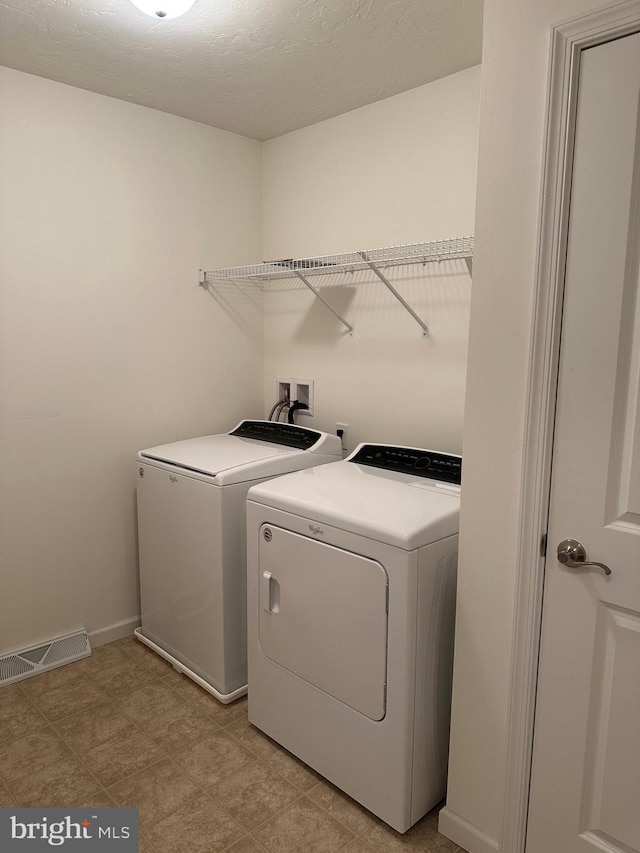 laundry area with washer and dryer