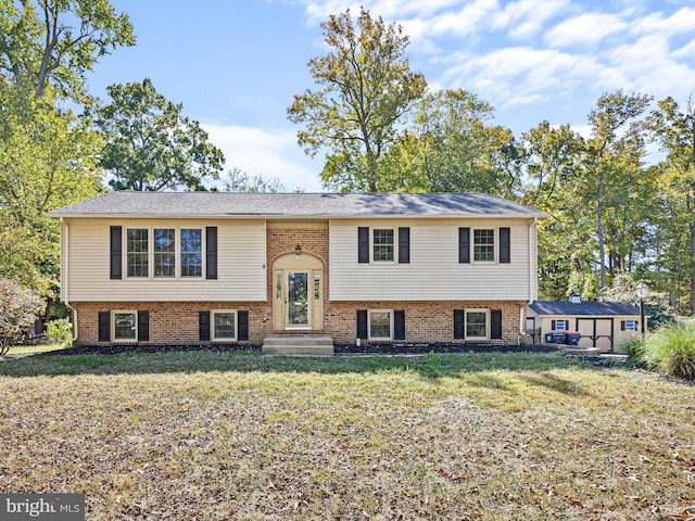 bi-level home with a front lawn