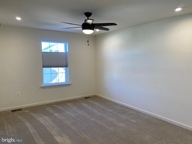 carpeted empty room with ceiling fan