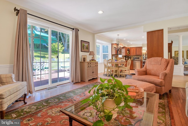 2123 Round Hill Rd, Fallston, MD 21047 - living room featuring light wood-style floors, healthy amount of natural light, ornamental molding, a chandelier, and recessed lighting