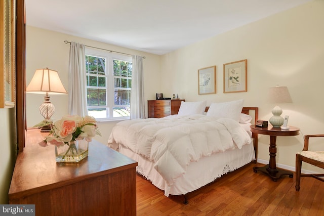 bedroom with hardwood / wood-style flooring