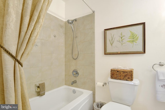 bathroom with toilet and shower / bath combo with shower curtain