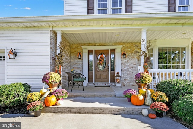 doorway to property featuring a porch