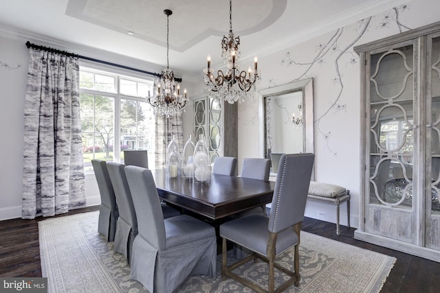 dining area featuring ornamental molding, a notable chandelier, dark wood-type flooring, and a raised ceiling