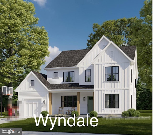 modern farmhouse featuring covered porch, a garage, and a front lawn