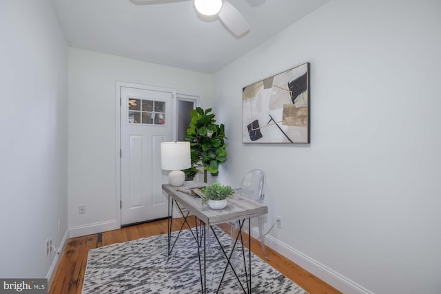 home office with ceiling fan and hardwood / wood-style flooring