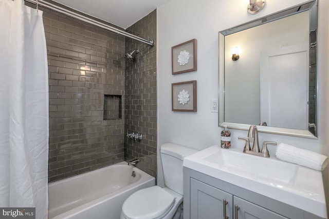 full bathroom featuring shower / bath combination with curtain, vanity, and toilet