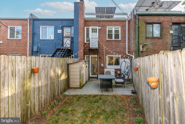 back of house featuring a patio