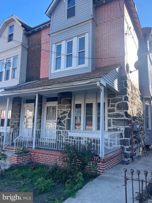 view of front of home featuring covered porch