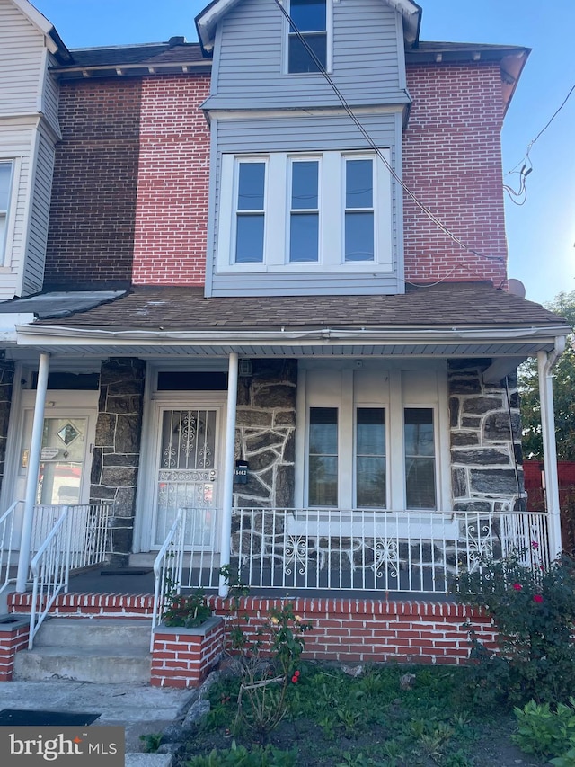 view of front of home featuring covered porch