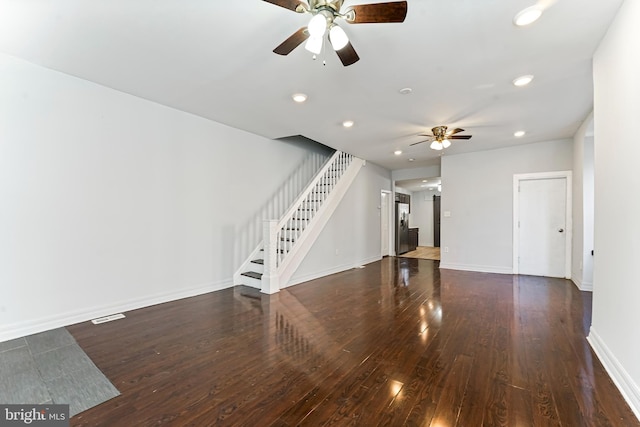 unfurnished living room with ceiling fan and dark hardwood / wood-style floors