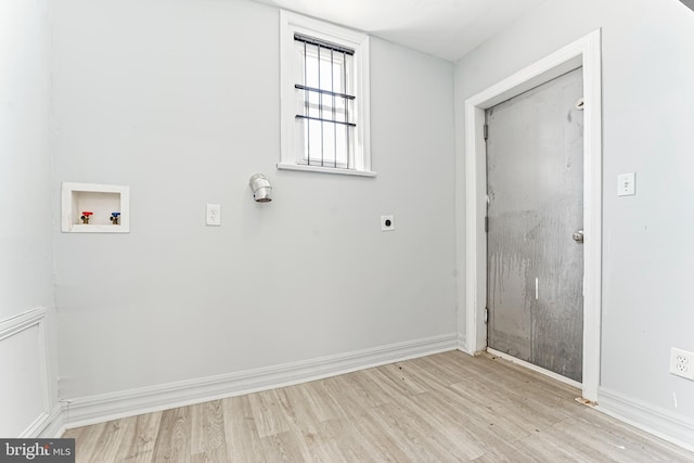 laundry area with washer hookup, hookup for an electric dryer, and light wood-type flooring