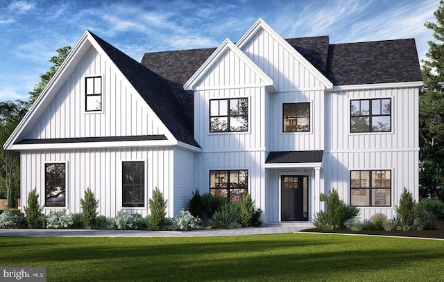 modern farmhouse style home featuring metal roof, a front lawn, board and batten siding, and roof with shingles