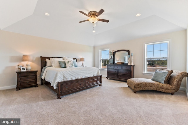 bedroom featuring recessed lighting, a raised ceiling, light colored carpet, and baseboards