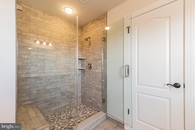 bathroom featuring a shower stall