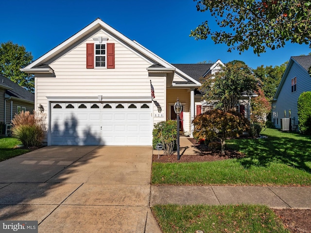 front of property with a front yard and a garage