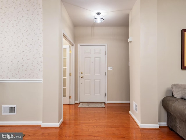 foyer featuring wood-type flooring