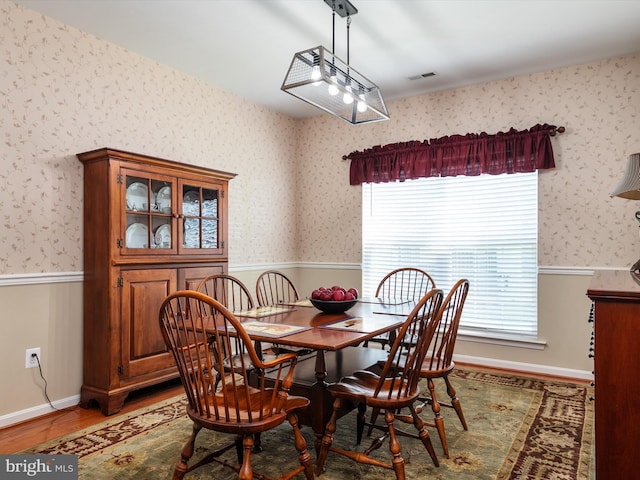 dining area with hardwood / wood-style flooring