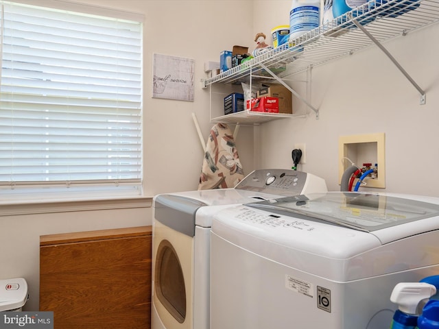 laundry room with washer and dryer and plenty of natural light