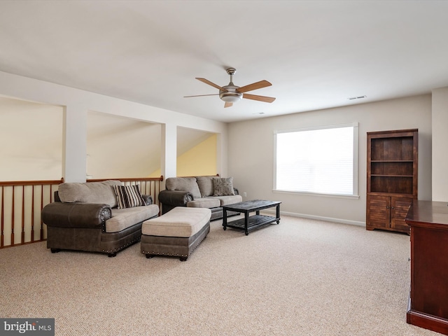 living room featuring light carpet and ceiling fan