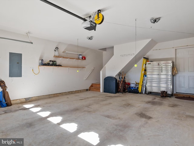 garage featuring a garage door opener and electric panel