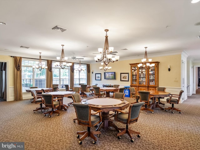 dining area featuring carpet floors and ornamental molding