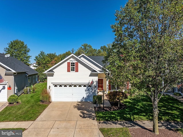 view of front of house featuring a garage and a front lawn