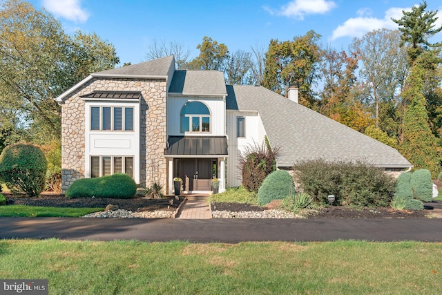 view of property featuring a front yard