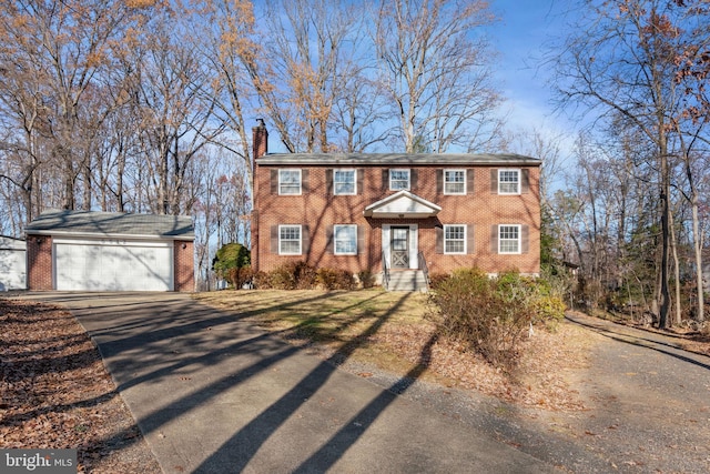 view of front of property featuring an outbuilding and a garage