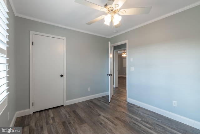 unfurnished bedroom with ornamental molding, dark hardwood / wood-style floors, and ceiling fan