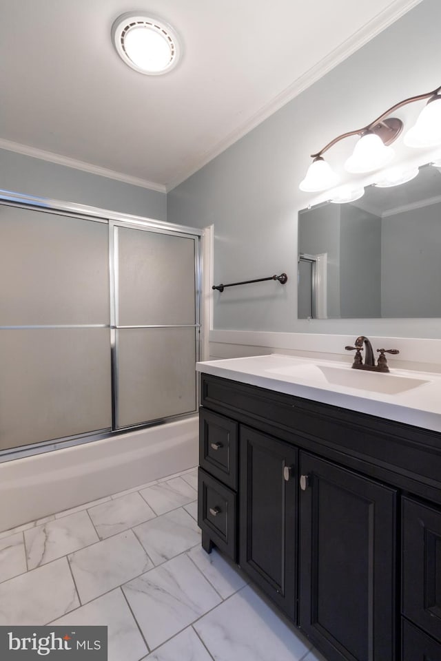 bathroom with vanity, ornamental molding, and bath / shower combo with glass door