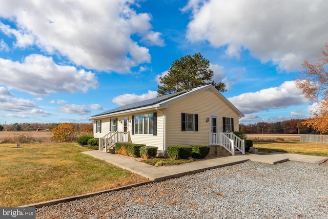 view of front of property with a front lawn