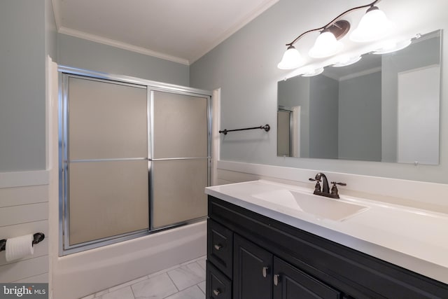 bathroom with vanity, crown molding, and enclosed tub / shower combo