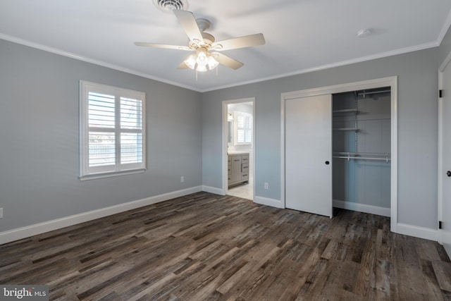 unfurnished bedroom featuring a closet, ceiling fan, ornamental molding, and dark hardwood / wood-style floors