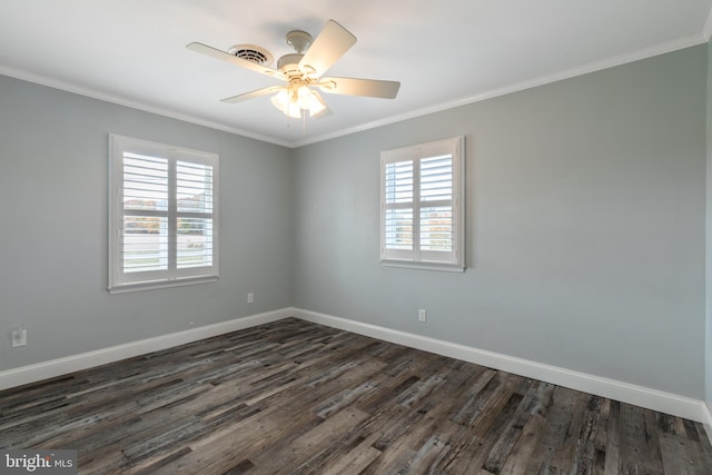 spare room with crown molding, a healthy amount of sunlight, and dark hardwood / wood-style floors