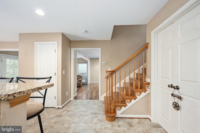 interior space featuring light stone countertops and light wood-type flooring