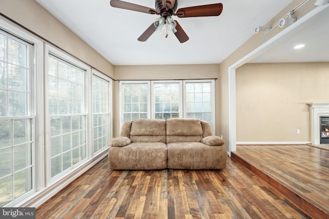 sunroom with ceiling fan and a healthy amount of sunlight